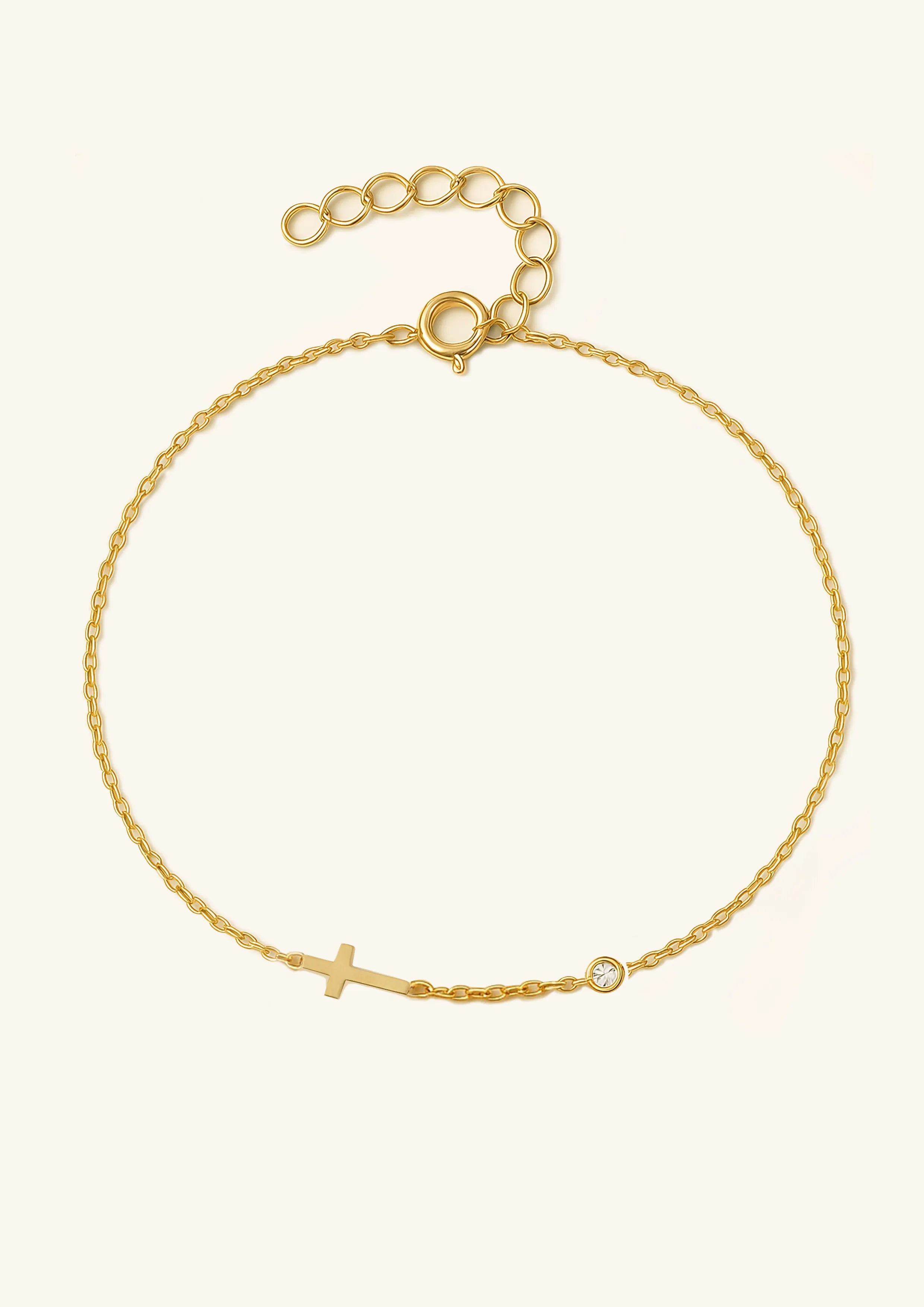 This elegant cubic zirconia cross bracelet is crafted from 925 sterling silver with gold plating, combining long-lasting beauty and brilliant luster